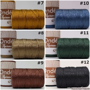 May include: A collection of ten spools of metallic embroidery floss in various colors, including gold, green, brown, black, and blue. The spools are labeled with numbers 7 through 12. The text "Ond&eacute; Macrame" is visible on the spools.