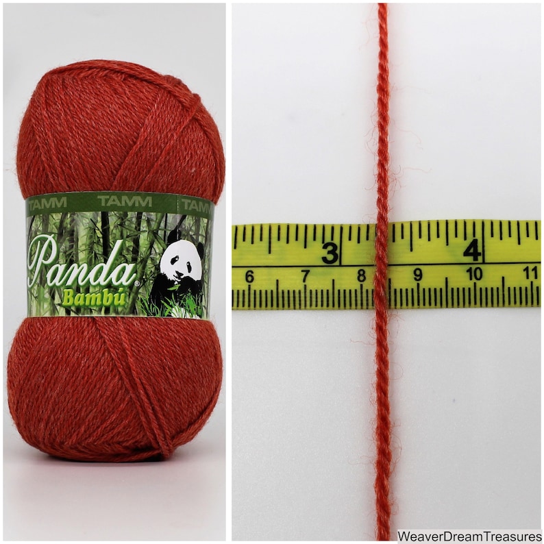 May include: A skein of red Panda Bamboo yarn with a label that says "Panda Bamb&uacute;" and a panda bear logo. The yarn is measured against a ruler, showing that it is approximately 3 inches long.