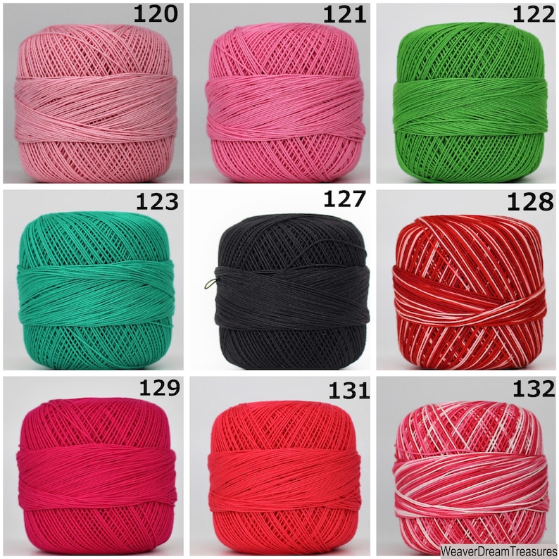 May include: Nine balls of yarn in various colors, including pink, green, black, red, and white. The yarn is arranged in a grid pattern with numbers 120, 121, 122, 123, 127, 128, 129, 131, and 132 printed above each ball.