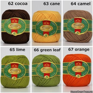May include: Six balls of cotton yarn in different colors, including cocoa, cane, camel, lime, green leaf, and orange. Each ball has a label with the brand name "Omega" and the number "5".