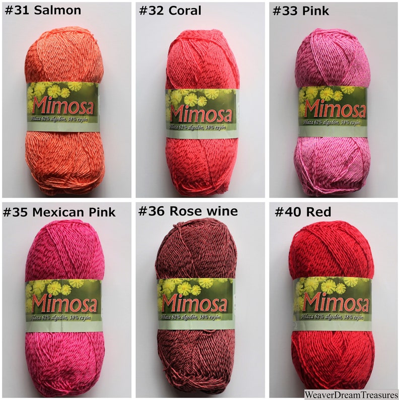 May include: Six balls of Mimosa yarn in various shades of pink, red, and orange. The yarn is labelled with the brand name "Mimosa" and the colour number. The colours are #31 Salmon, #32 Coral, #33 Pink, #35 Mexican Pink, #36 Rose wine, and #40 Red.