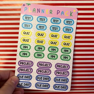 May include: A sheet of colorful planner stickers with the words "Planner Pack" at the top. The stickers are in various colors and have the words "Test", "Quiz", "HW", "Project", and "Due Date" on them.