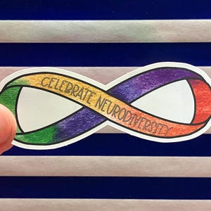 May include: A sticker with a rainbow infinity symbol and the text "Celebrate Neurodiversity".