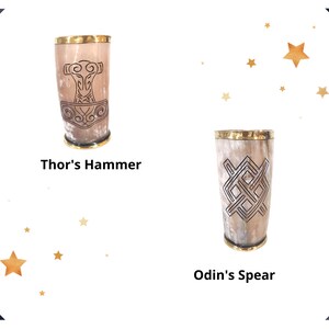 May include: Two drinking horns with brass rims and intricate designs. The horn on the left has a design of Thor's hammer, while the horn on the right has a design of Odin's spear.