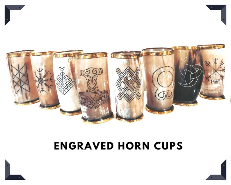 May include: Set of eight engraved horn cups with various Viking-inspired designs. The cups have a natural brown color with gold trim and black engravings.