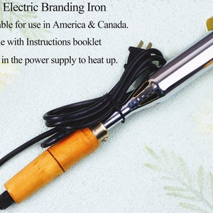 May include: A 110V electric branding iron with a wooden handle and a chrome metal heating element. The iron has a gold-colored metal head with a textured surface. The iron is suitable for use in America and Canada. It comes with instructions.