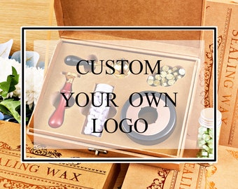 May include: A wooden box with a clear lid containing a wax seal kit. The kit includes a wax seal stamp, a small jar of wax, and a small bottle of wax beads. The box has the text "CUSTOM YOUR OWN LOGO" printed on it.