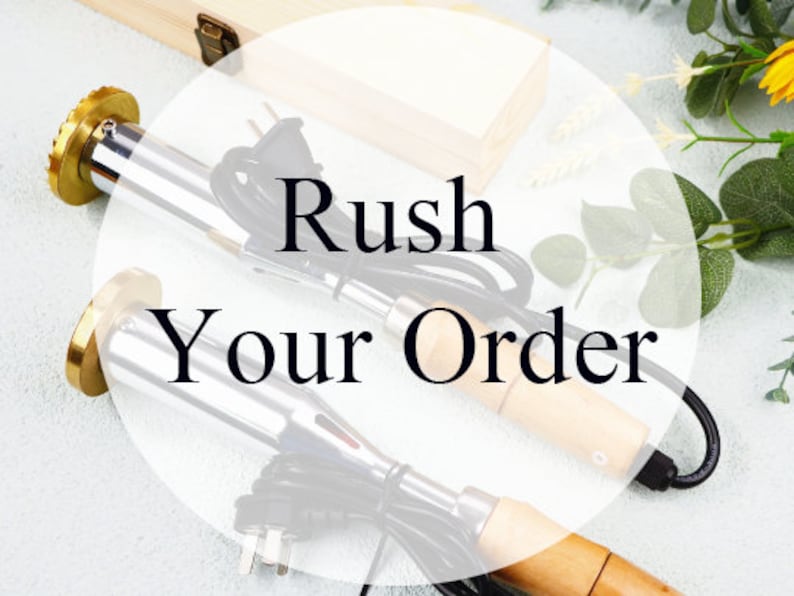 May include: Two electric leather crafting tools with wooden handles and brass tips. The tools are on a white surface with a wooden box and green leaves in the background. The text "Rush Your Order" is superimposed on the image.