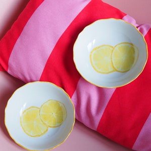 Two small hollow plates made of lemon porcelain