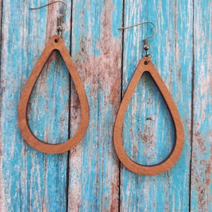 Hollow/cut out wood earrings in a teardrop shape