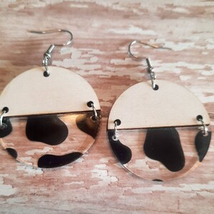 Wood and cow print acrylic connector earrings on hypoallergenic stainless steel hooks
