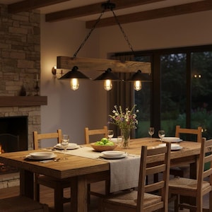 May include: A linear pendant light fixture featuring a horizontal wooden beam suspended by black chains, holding three black metal dome shades with exposed Edison-style light bulbs, illuminating a wooden dining table.