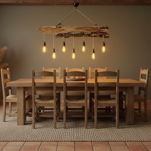 May include: A rustic dining room set with a large wooden table and matching chairs. A unique light fixture hangs above the table, and a large vase with dried plants sits in the corner. The room has a warm, inviting atmosphere.