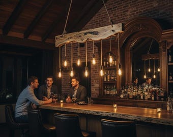 May include: A rustic wooden beam chandelier suspended by ropes, featuring eight hanging Edison-style light bulbs. The fixture is positioned above a long, polished wooden bar counter with a live edge, set within a dimly lit room with brick walls.