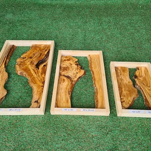 May include: Three wooden frames with olive wood slabs inside. The frames are different sizes: 22" x 12", 16" x 13", and 12" x 8".