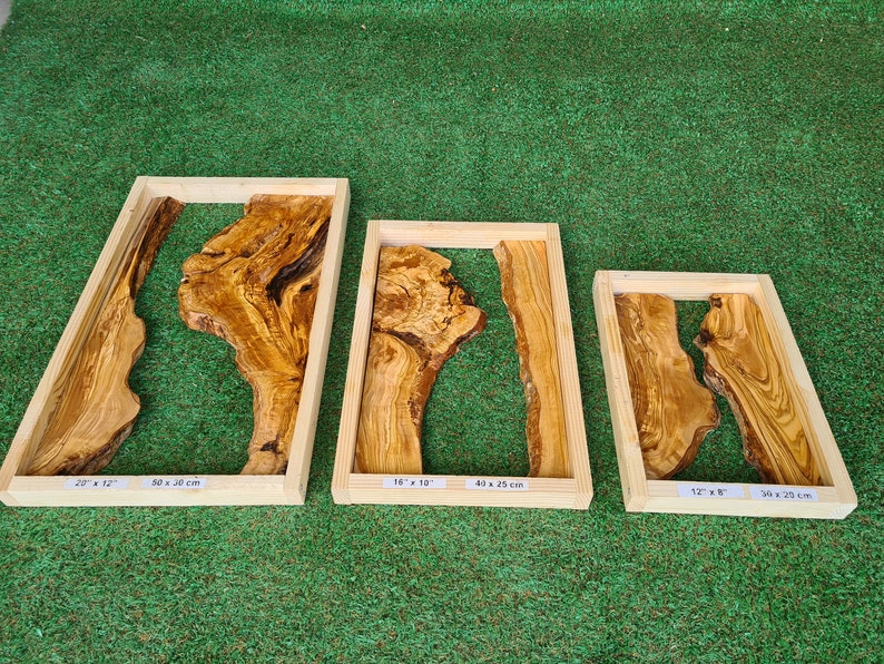 May include: Three wooden frames with olive wood slabs inside. The frames are different sizes: 22" x 12", 16" x 13", and 12" x 8".