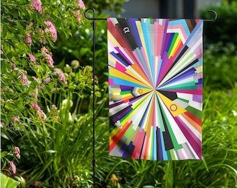 May include: A colorful garden flag with a circular design of various colored stripes radiating outward from the center. The flag is attached to a black metal pole.