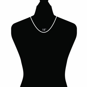 May include: A black mannequin wearing a silver chain necklace. The necklace is 18 inches long.