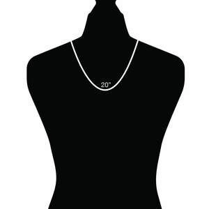 May include: A white necklace on a black mannequin. The necklace is 20 inches long.