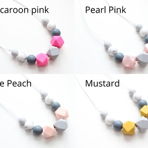 May include: Four silicone teething necklaces with different colored beads. The necklaces are made with gray, white, and a variety of colored beads. The colors are macaroon pink, pearl pink, pale peach, and mustard.