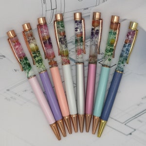 Beautiful metal ballpoint pens with flowers in liquid, also with personal name engraving