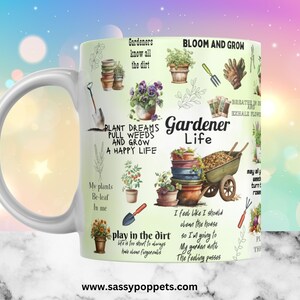 May include: White ceramic mug with a green background and colorful illustrations of gardening tools, plants, and flowers. The text on the mug reads "Gardeners know all the dirt", "Bloom and Grow", "Plant Dreams Pull Weeds and Grow a Happy Life", "Gardener Life", "My plants Be-leaf in me", "Play in the dirt", "I feel like I should clean the house so I'm going to my garden until the feeling passes", "Breathe in Sun and Exhale Flowers", "May all weeds turn to roses", and "www.sassypoppets.com".