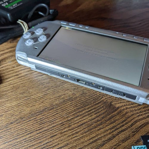 Sony PlayStation PsP 3000 console, charger. Fully Tested working. 32gb microSD shops w/ tons of PSP, PS1 games etc. Cfw Emulators. Custom firmware