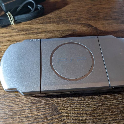 Sony PlayStation PsP 3000 console, charger. Fully Tested working. 32gb microSD shops w/ tons of PSP, PS1 games etc. Cfw Emulators. Custom firmware