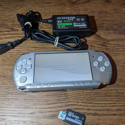 Sony PlayStation PsP 3000 console, charger. Fully Tested working. 32gb microSD shops w/ tons of PSP, PS1 games etc. Cfw Emulators. Custom firmware