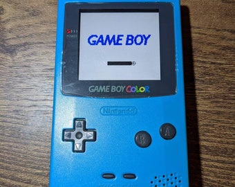 Gameboy Color with Funny playing Ips Lcd Q5 oversized screen. OEM Teal Shell.  Also has retro pixel mode.