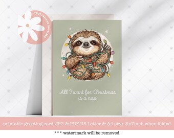 May include: A Christmas greeting card featuring a cartoon sloth wrapped in colorful Christmas lights. The sloth is brown with a smiling face. The text "All I want for Christmas is a nap" is below the sloth.