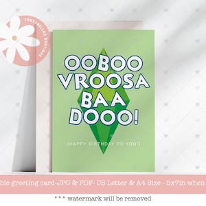 以下が含まれることがあります： 白と青で「OOBOO VROOSA BAA DOOO！」と書かれた、緑色のグリーティングカード。緑色のひし形があります。「（HAPPY BIRTHDAY TO YOU！）」という文字が下にあります。白い花のロゴが左上にあります。