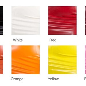 May include: A colour chart displaying eight swatches of smooth, reflective material. The colours are labelled as Black, White, Red, Plum, Burnt Orange, Orange, Yellow, and Bubblegum Pink. Each square shows a solid, vibrant hue with subtle folds.