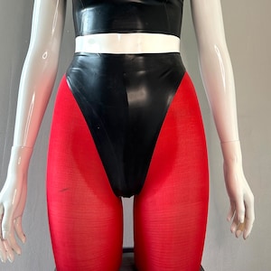 May include: A black latex high-waisted swimsuit with a white waistband and red tights.