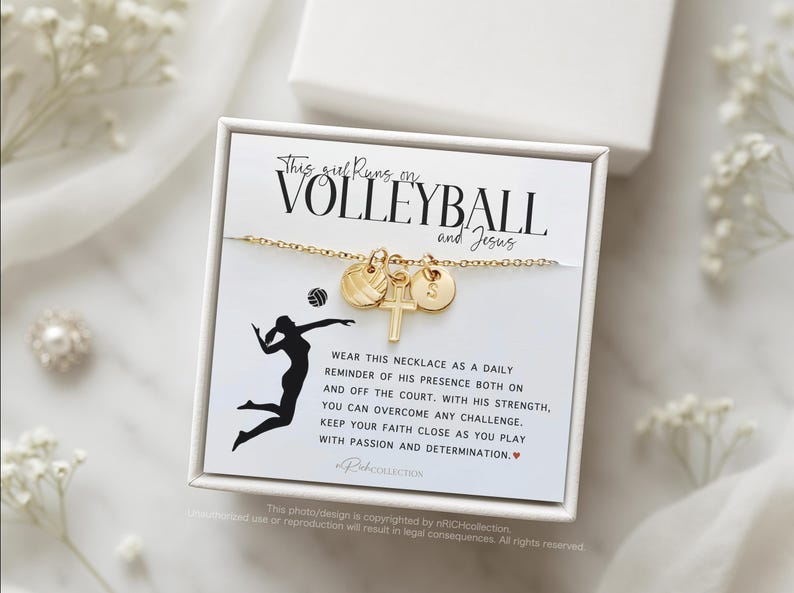 May include: A gold necklace with a volleyball charm, a cross charm, and a letter charm. The necklace is displayed on a white card with the text "This girl runs on volleyball and Jesus".