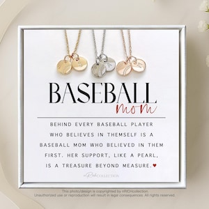 May include: A white card with the text "BASEBALL mom" in black lettering. The card has a quote about baseball moms and a small red heart. Three necklaces with baseball charms are displayed on the card.