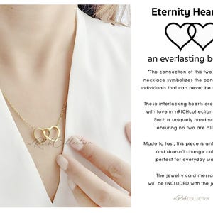 May include: Gold necklace with two interlocking heart charms. The necklace is on a model's neck. The text "Eternity Hearts" and "an everlasting bond" is on the image. The text "The connection of this two hearts necklace symbolizes the bond of two individuals that can never be undone." is also on the image.