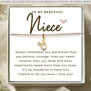 May include: A white card with a gold necklace and a charm that says "Niece". The card reads "To my beautiful Niece. Always remember you are braver than you believe, stronger than you seem, smarter than you think and most importantly loved more than you know. It's so wonderful to have this chance to let you know I love you!"