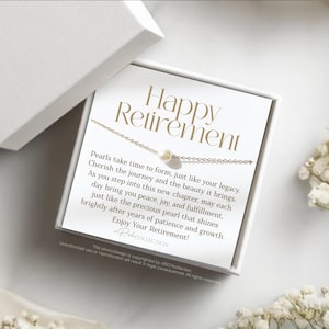 May include: A white card with the text "Happy Retirement" and a message about pearls. The card is in a white box with a pearl necklace on top.