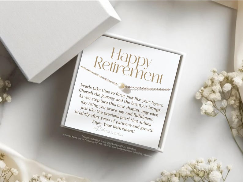May include: A white card with the text "Happy Retirement" and a message about pearls. The card is in a white box with a pearl necklace on top.