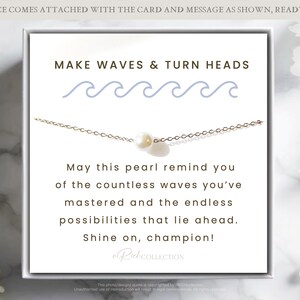 May include: A white card with the text "MAKE WAVES & TURN HEADS" and a blue wave graphic. The card also includes the text "May this pearl remind you of the countless waves you've mastered and the endless possibilities that lie ahead. Shine on, champion!" and the text "RuhCOLLECTION".
