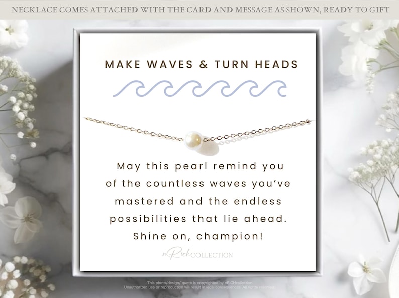 May include: A white card with the text "MAKE WAVES & TURN HEADS" and a blue wave graphic. The card also includes the text "May this pearl remind you of the countless waves you've mastered and the endless possibilities that lie ahead. Shine on, champion!" and the text "RuhCOLLECTION".