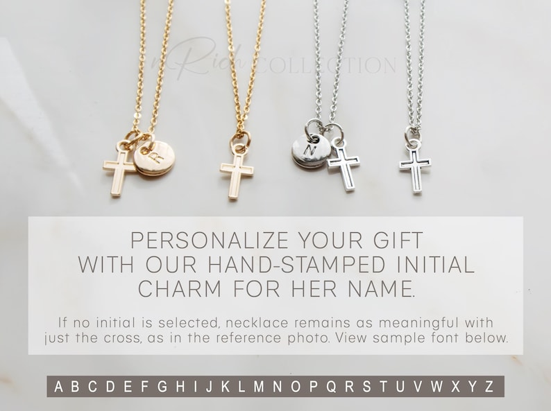 May include: Two gold and silver necklaces with a cross charm and a small round charm with an initial. The initial charms are available in the alphabet shown below.  The text reads: "PERSONALIZE YOUR GIFT WITH OUR HAND-STAMPED INITIAL CHARM FOR HER NAME. If no initial is selected, necklace remains as meaningful with just the cross, as in the reference photo. View sample font below. ABCDEFGHIJKLMNOPQRSTUVWXYZ"