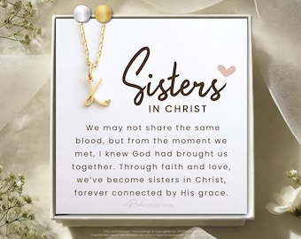May include: A white card with the text "Sisters in Christ" and a quote about faith and love. The card is accompanied by a gold necklace with a cursive letter K pendant.