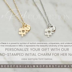 May include: Two gold and silver necklaces with puzzle piece charms. The charms have a heart cut out of the center. The necklaces are on a white marble background. The text "PERSONALIZE YOUR GIFT WITH OUR HAND-STAMPED INITIAL CHARM FOR HER NAME." is below the necklaces. The text "view sample font below." is below the text. The alphabet is displayed below the text.