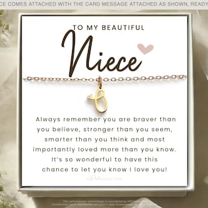 May include: A white card with a gold necklace and a charm that says "Niece". The card reads "To my beautiful Niece. Always remember you are braver than you believe, stronger than you seem, smarter than you think and most importantly loved more than you know. It's so wonderful to have this chance to let you know I love you!"