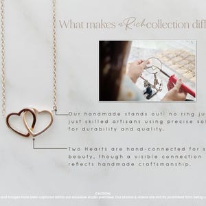 May include: A delicate gold necklace with two interlocking heart charms. The necklace is handmade and features a visible connection between the hearts, showcasing the craftsmanship.