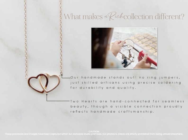 May include: A delicate gold necklace with two interlocking heart charms. The necklace is handmade and features a visible connection between the hearts, showcasing the craftsmanship.