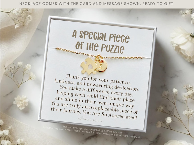 May include: A white gift box with a gold necklace featuring a puzzle piece charm. The box includes a card with the message "A Special Piece of the Puzzle" and a heartfelt message thanking someone for their patience, kindness, and dedication.