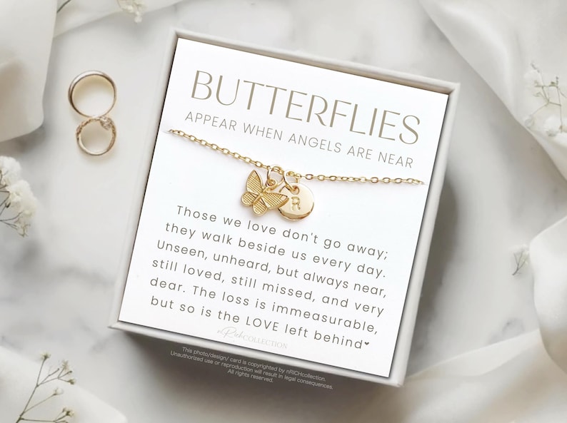 May include: A gold butterfly necklace with a charm that says "R" in a heart shape. The necklace comes in a white box with a card that reads "Butterflies appear when angels are near." Those we love don't go away; they walk beside us every day. Unseen, unheard, but always near, still loved, still missed, and very dear. The loss is immeasurable, but so is the love left behind.